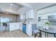 Bright kitchen featuring white cabinets, modern appliances, and an adjacent dining area with lots of natural light at 6720 Gilda Dr, Tampa, FL 33625