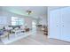 Inviting living room with a ceiling fan, and seamless flow into the dining area at 6720 Gilda Dr, Tampa, FL 33625