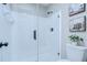 Modern tiled shower with glass enclosure and contemporary fixtures in a bathroom with neutral tones at 6720 Gilda Dr, Tampa, FL 33625