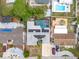 Aerial view of home with backyard pool, solar panels, and lush landscaping at 7631 Ironbark Dr, Port Richey, FL 34668