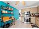 Well-lit kitchen features stainless steel appliances, tile flooring, and ample cabinet space at 7631 Ironbark Dr, Port Richey, FL 34668