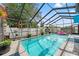 Enclosed pool area offers a private outdoor space to enjoy the Florida sunshine at 7631 Ironbark Dr, Port Richey, FL 34668