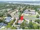Aerial view showing house with pool, neighborhood, and waterfront location at 7802 134Th St, Seminole, FL 33776