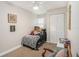 Comfortable bedroom featuring a bed with stuffed animals, a ceiling fan, and a closet at 7802 134Th St, Seminole, FL 33776