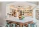 Bright kitchen featuring a breakfast bar, pendant lights, and modern appliances at 7802 134Th St, Seminole, FL 33776