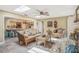 Bright living room featuring an open layout, skylights, and seamlessly connecting to the kitchen at 7802 134Th St, Seminole, FL 33776
