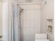 Modern shower features a rainfall shower head, a hand held sprayer, and built-in storage at 7802 134Th St, Seminole, FL 33776