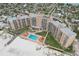 Beautiful aerial view of beachfront condo, pool area, and Gulf of Mexico at 880 Mandalay Ave # C513, Clearwater Beach, FL 33767