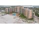Aerial view of a condo building on the beach with pool at 880 Mandalay Ave # C513, Clearwater Beach, FL 33767