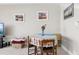Dining table set for two with wall decor and artwork at 880 Mandalay Ave # C513, Clearwater Beach, FL 33767