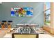 Game room features foosball, ping pong and ample light from a large window with beach views at 880 Mandalay Ave # C513, Clearwater Beach, FL 33767