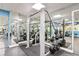 Well-equipped gym with mirrors and various weightlifting machines at 880 Mandalay Ave # C513, Clearwater Beach, FL 33767