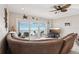 Living room with sectional sofa, tv, and ocean view at 880 Mandalay Ave # C513, Clearwater Beach, FL 33767