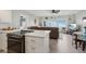 Open layout of kitchen and living room with a coastal view at 880 Mandalay Ave # C513, Clearwater Beach, FL 33767