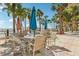 Relax in the outdoor seating area, surrounded by palm trees and ocean views at 880 Mandalay Ave # C513, Clearwater Beach, FL 33767