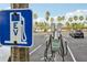 Electric vehicle charging station in parking lot with palm trees at 880 Mandalay Ave # C513, Clearwater Beach, FL 33767