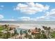Coastal view of pool, white sand beach, and Gulf of Mexico at 880 Mandalay Ave # C513, Clearwater Beach, FL 33767
