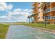 Enjoy a game of shuffleboard at this beachfront condo, with a backdrop of palm trees and ocean at 880 Mandalay Ave # C513, Clearwater Beach, FL 33767