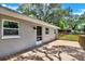 Exterior of home featuring a wooden deck with backyard views and a white-painted exterior at 9448 Mcintyre Rd, Brooksville, FL 34601