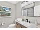 Bathroom featuring updated vanity, modern fixtures, and a window for natural light at 9448 Mcintyre Rd, Brooksville, FL 34601