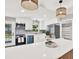 Bright kitchen with stainless steel appliances, white cabinets, and a spacious island at 9448 Mcintyre Rd, Brooksville, FL 34601