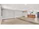 Open living area with updated lighting, steps to the kitchen, and modern decor at 9448 Mcintyre Rd, Brooksville, FL 34601