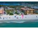 Aerial view showcases the beach, ocean, and nearby homes and condos along the scenic coastline at 960 Gulf Blvd # 5, Indian Rocks Beach, FL 33785