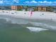 A scenic aerial view of the beach, ocean, and nearby houses and condos along the coastline at 960 Gulf Blvd # 5, Indian Rocks Beach, FL 33785