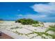 Sandy dunes and blue beach, perfect for vacations and enjoying the outdoors at 960 Gulf Blvd # 5, Indian Rocks Beach, FL 33785
