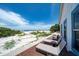 Inviting beachfront deck with lounge chairs offers serene ocean views and direct beach access at 960 Gulf Blvd # 5, Indian Rocks Beach, FL 33785