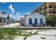 Beach cottage with a wooden deck and lounge chairs, ideal for relaxing by the sea at 960 Gulf Blvd # 5, Indian Rocks Beach, FL 33785