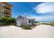 Charming beach cottage with white siding and blue trim, offering a cozy retreat by the ocean at 960 Gulf Blvd # 5, Indian Rocks Beach, FL 33785