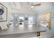 Kitchen featuring light blue walls, white cabinets, and beach views from the windows at 960 Gulf Blvd # 5, Indian Rocks Beach, FL 33785