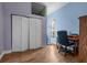 Light and bright bedroom with hardwood floors, closet and a desk near the window at 10457 Cranston St, Spring Hill, FL 34608