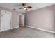 Comfortable bedroom with neutral carpet, closet, and view to hall at 10457 Cranston St, Spring Hill, FL 34608