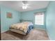 Well-lit bedroom featuring carpet, a bed with floral design and a window at 10457 Cranston St, Spring Hill, FL 34608