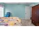 Bedroom featuring a bed with floral design, closet and entry to the hall at 10457 Cranston St, Spring Hill, FL 34608