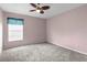 Cozy bedroom featuring neutral carpet, ceiling fan, and window with blinds at 10457 Cranston St, Spring Hill, FL 34608