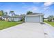 Exterior of a one-story home with an attached garage and a wide driveway at 10457 Cranston St, Spring Hill, FL 34608