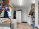 Functional laundry area with a washer, dryer, storage cabinets, and an access door to the exterior at 10457 Cranston St, Spring Hill, FL 34608
