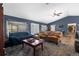 Spacious living room with vaulted ceiling, ceiling fan, and open layout at 10457 Cranston St, Spring Hill, FL 34608