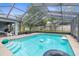 Inviting screened pool and patio area, perfect for entertaining and relaxation at 10457 Cranston St, Spring Hill, FL 34608