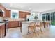 Well-equipped kitchen with granite countertops, stainless steel appliances, and an adjacent dining area for casual meals at 11444 Shoreline Trl, Parrish, FL 34219