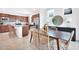 Inviting kitchen with wood cabinets, stainless steel appliances and a breakfast bar flowing into the dining area at 11444 Shoreline Trl, Parrish, FL 34219