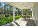 Enjoy outdoor dining on the brick paver patio surrounded by lush greenery and picturesque backyard views at 11444 Shoreline Trl, Parrish, FL 34219