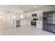 Bright kitchen featuring white cabinets, stainless steel appliances, and ample counter space at 11448 Bay Gardens Loop, Riverview, FL 33569
