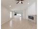 Spacious living area with tile floors, recessed lighting, and modern fireplace at 11448 Bay Gardens Loop, Riverview, FL 33569