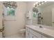 Bright bathroom featuring a single sink vanity, toilet and shower at 1156 Ridgegrove W Dr, Palm Harbor, FL 34683