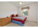 Cozy bedroom with ceiling fan, side table and dresser at 1156 Ridgegrove W Dr, Palm Harbor, FL 34683