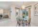 The dining area is full of natural light and has great views of the back yard and pool at 1156 Ridgegrove W Dr, Palm Harbor, FL 34683